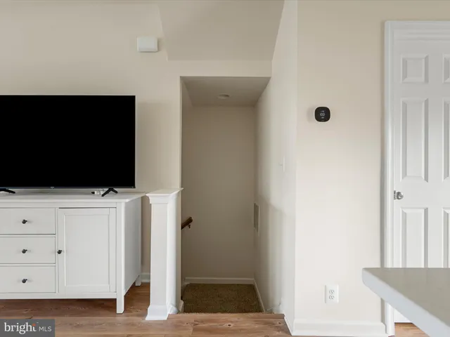 a view of kitchen with furniture and wooden floor