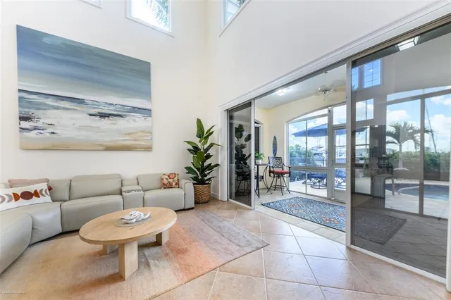 a living room with furniture and a dining table