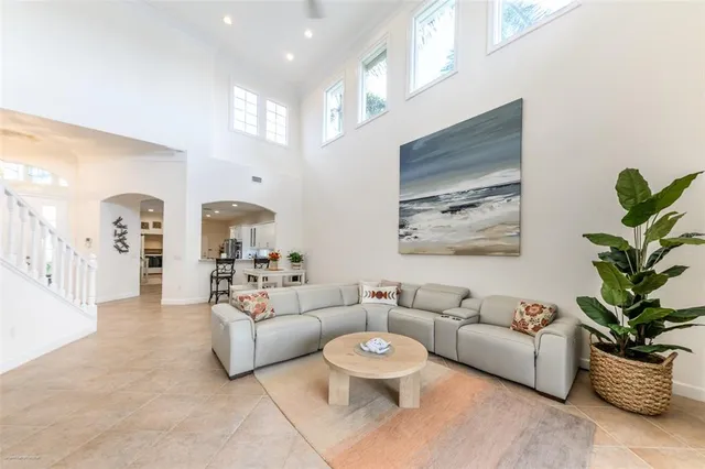 a kitchen with stainless steel appliances granite countertop a sink and a refrigerator