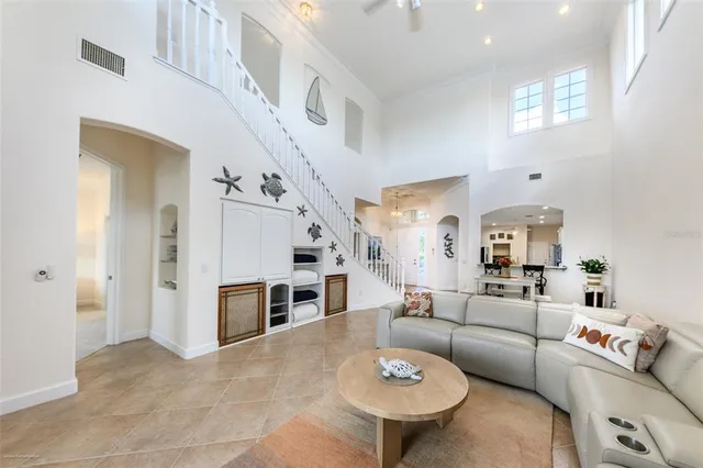 a kitchen with stainless steel appliances kitchen island granite countertop a refrigerator and cabinets