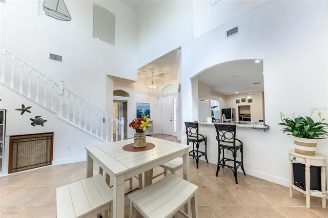 a dining room with furniture and a window