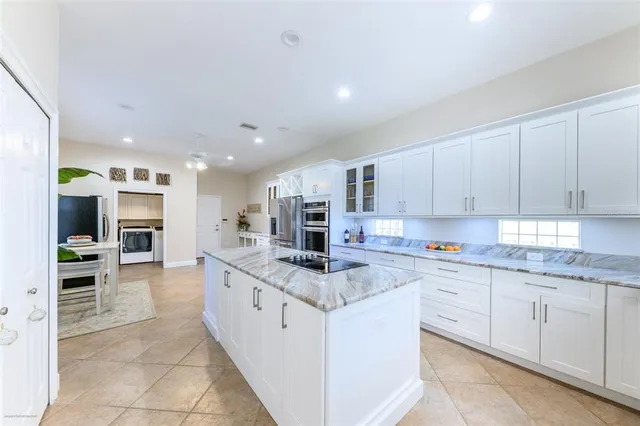 a spacious bedroom with a bed and a window