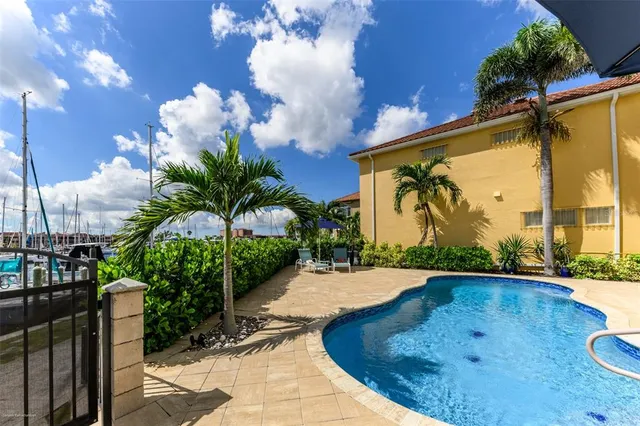a view of a swimming pool with a patio