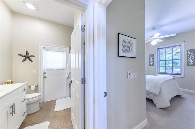 a bathroom with a double vanity sink toilet and shower
