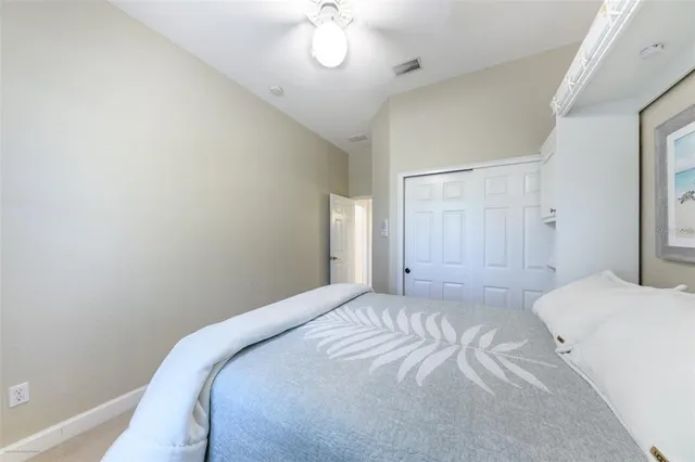 a en suite bathroom with a toilet sink and a mirror