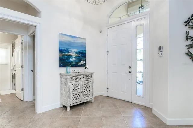 a view of a livingroom with furniture and staircase
