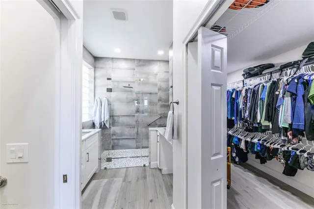 a patio with a table and chairs under an umbrella