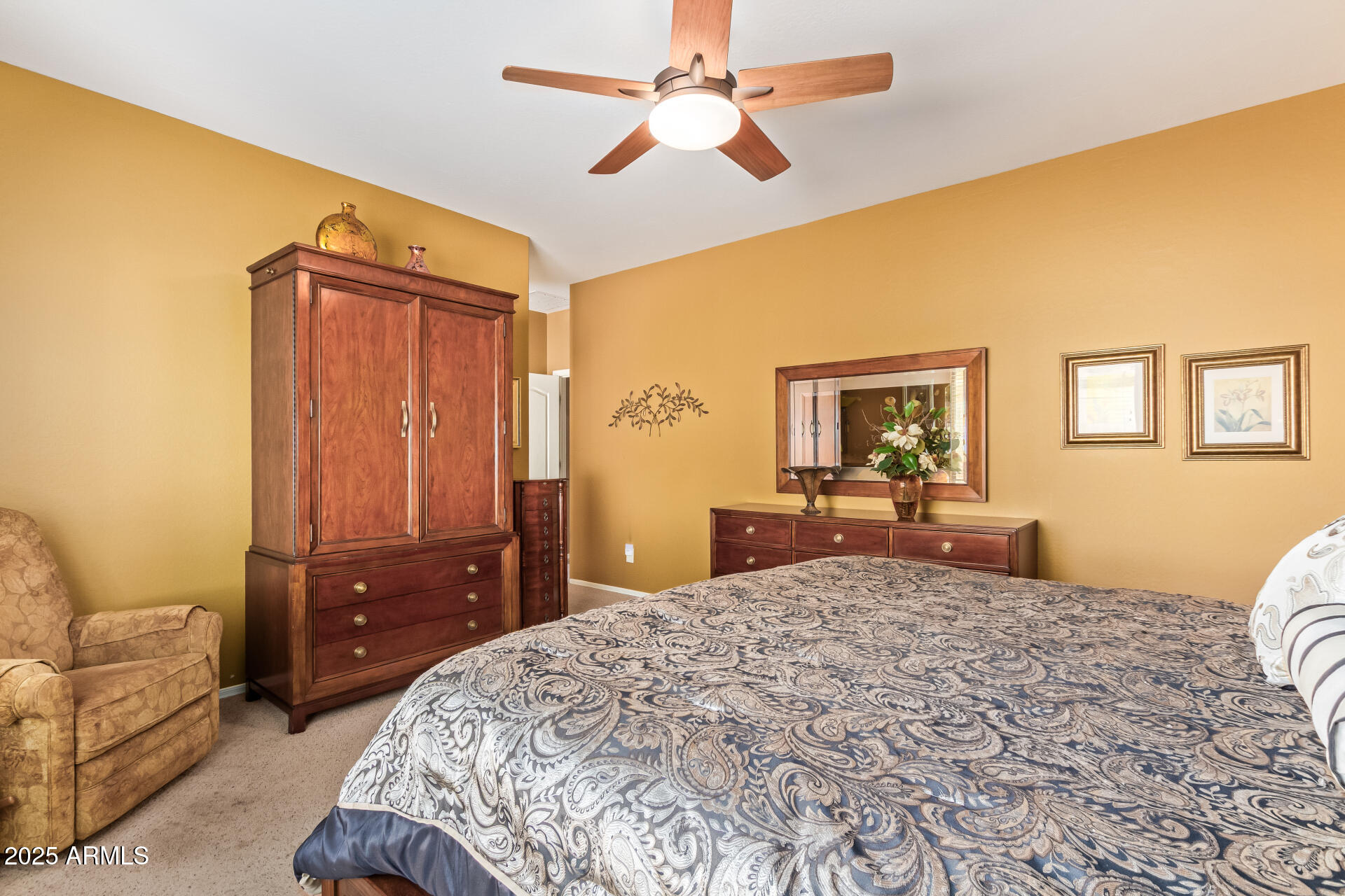 6934 West Beverly Road Laveen, AZ 85339 - Photo 15 of 31 a bedroom with a large bed and a couch