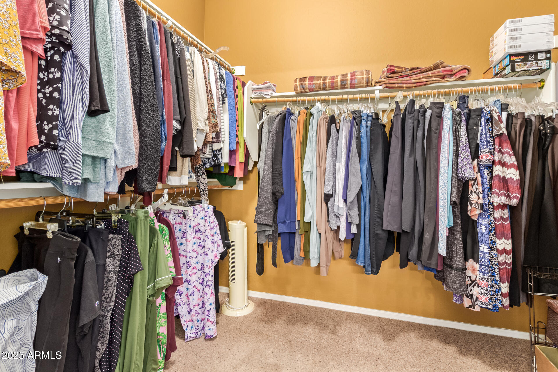 6934 West Beverly Road Laveen, AZ 85339 - Photo 18 of 31 a view of walk in closet with clothes