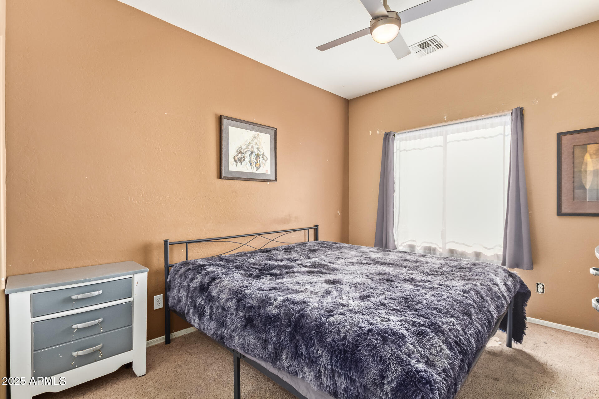 6934 West Beverly Road Laveen, AZ 85339 - Photo 19 of 31 a bedroom with a bed and a cabinets