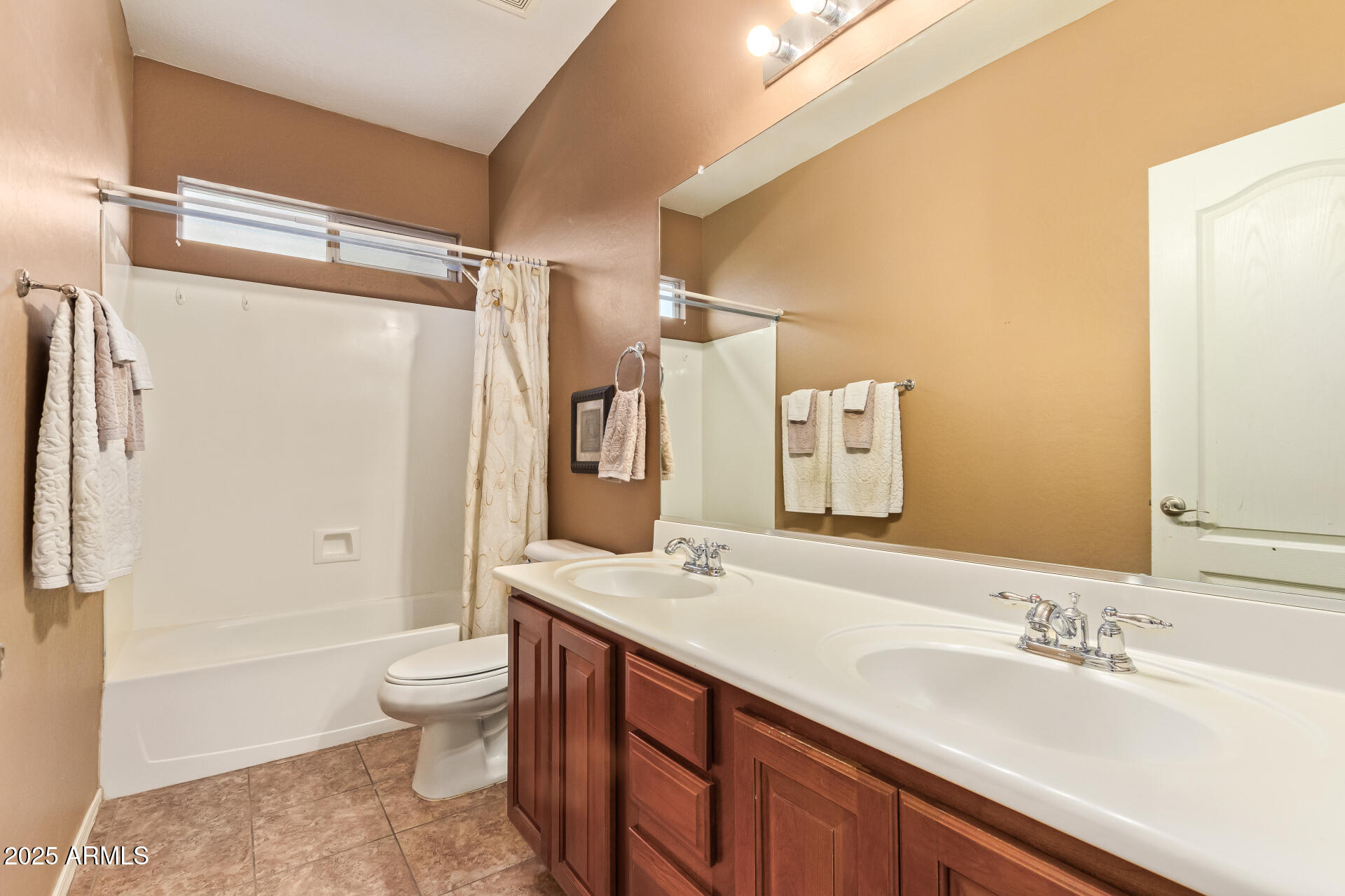 6934 West Beverly Road Laveen, AZ 85339 - Photo 21 of 31 a spacious bathroom with a granite countertop sink toilet and shower