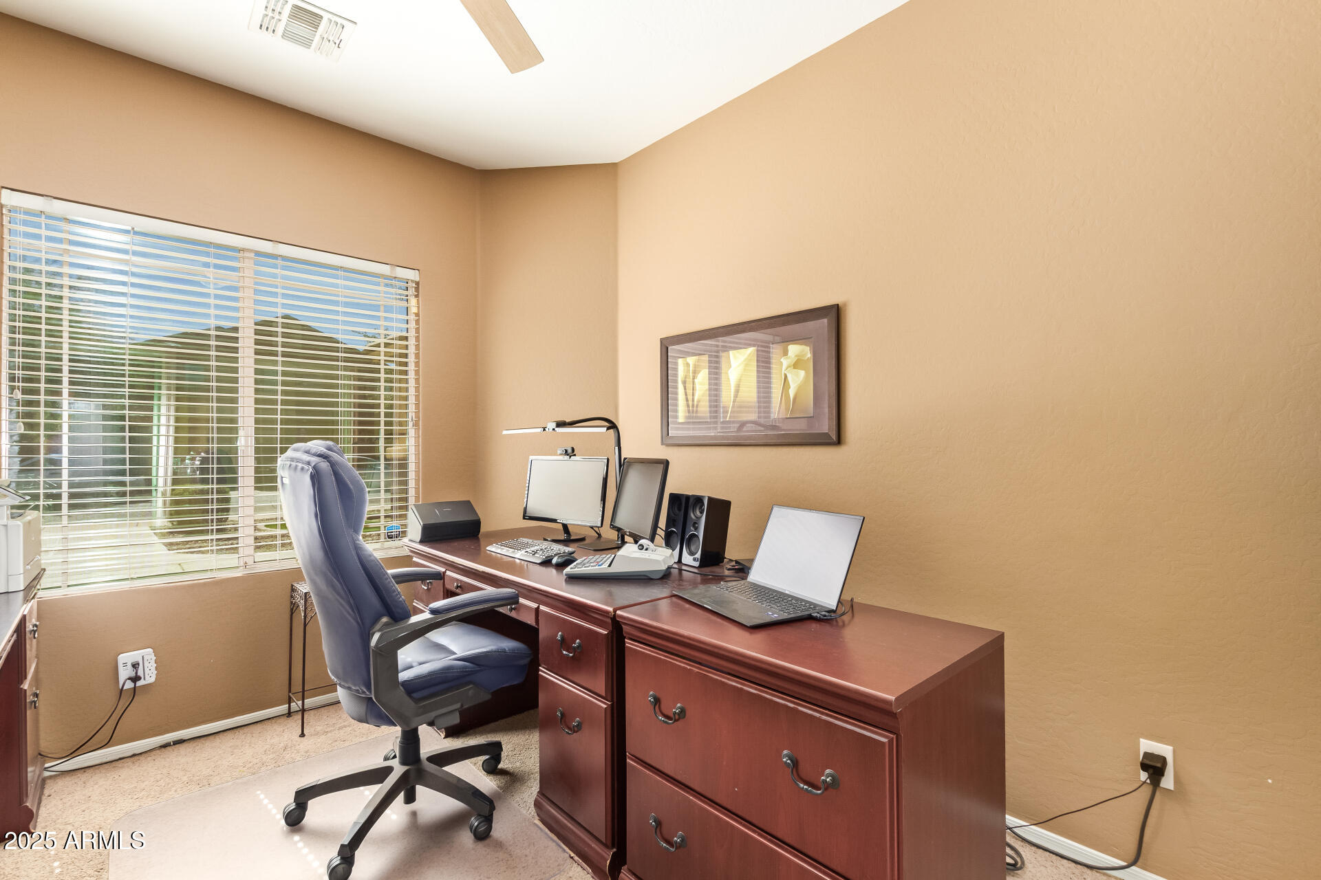6934 West Beverly Road Laveen, AZ 85339 - Photo 24 of 31 a view of a workspace with furniture and a window