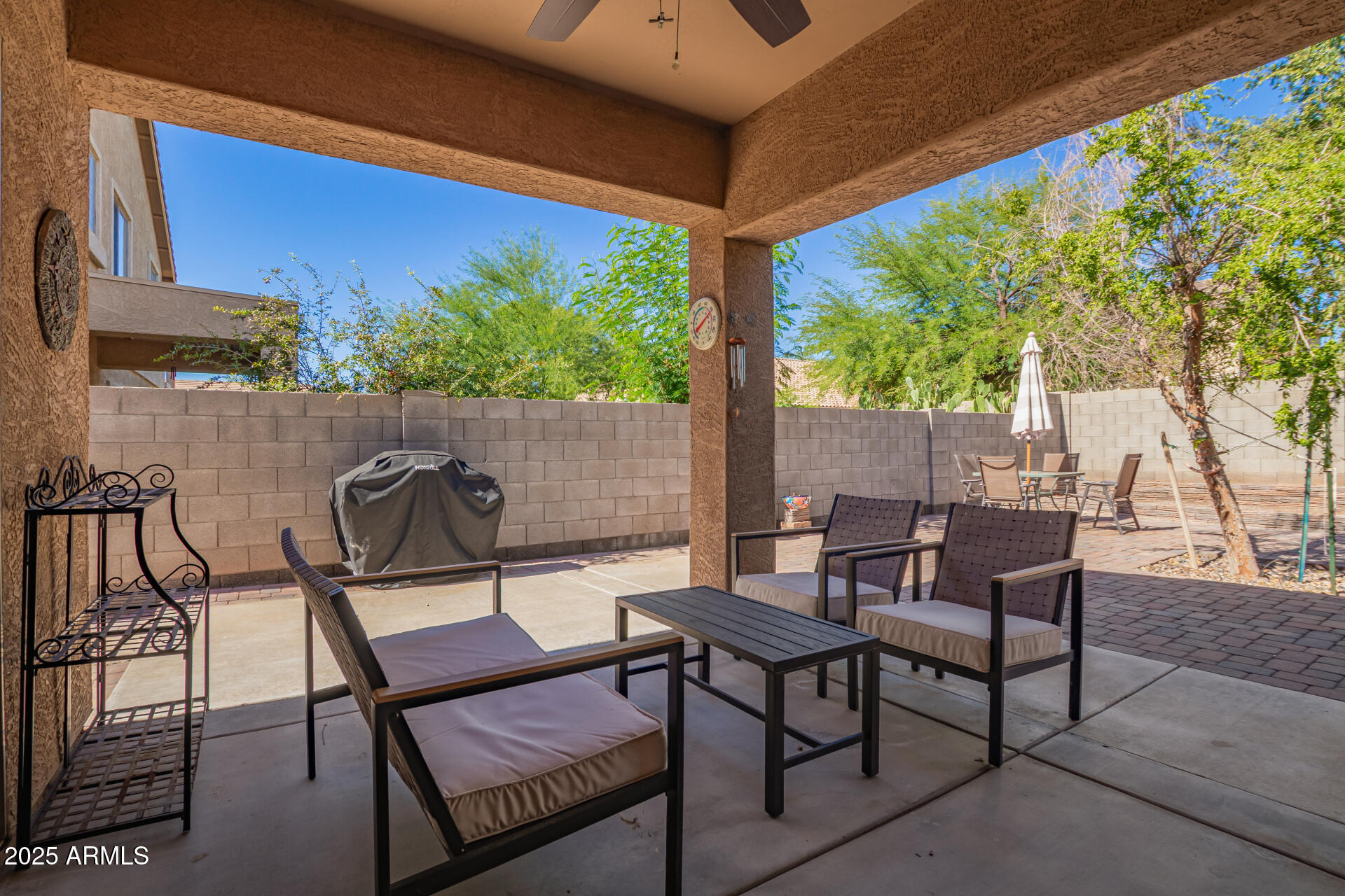 6934 West Beverly Road Laveen, AZ 85339 - Photo 26 of 31 a view of a chairs and table in patio