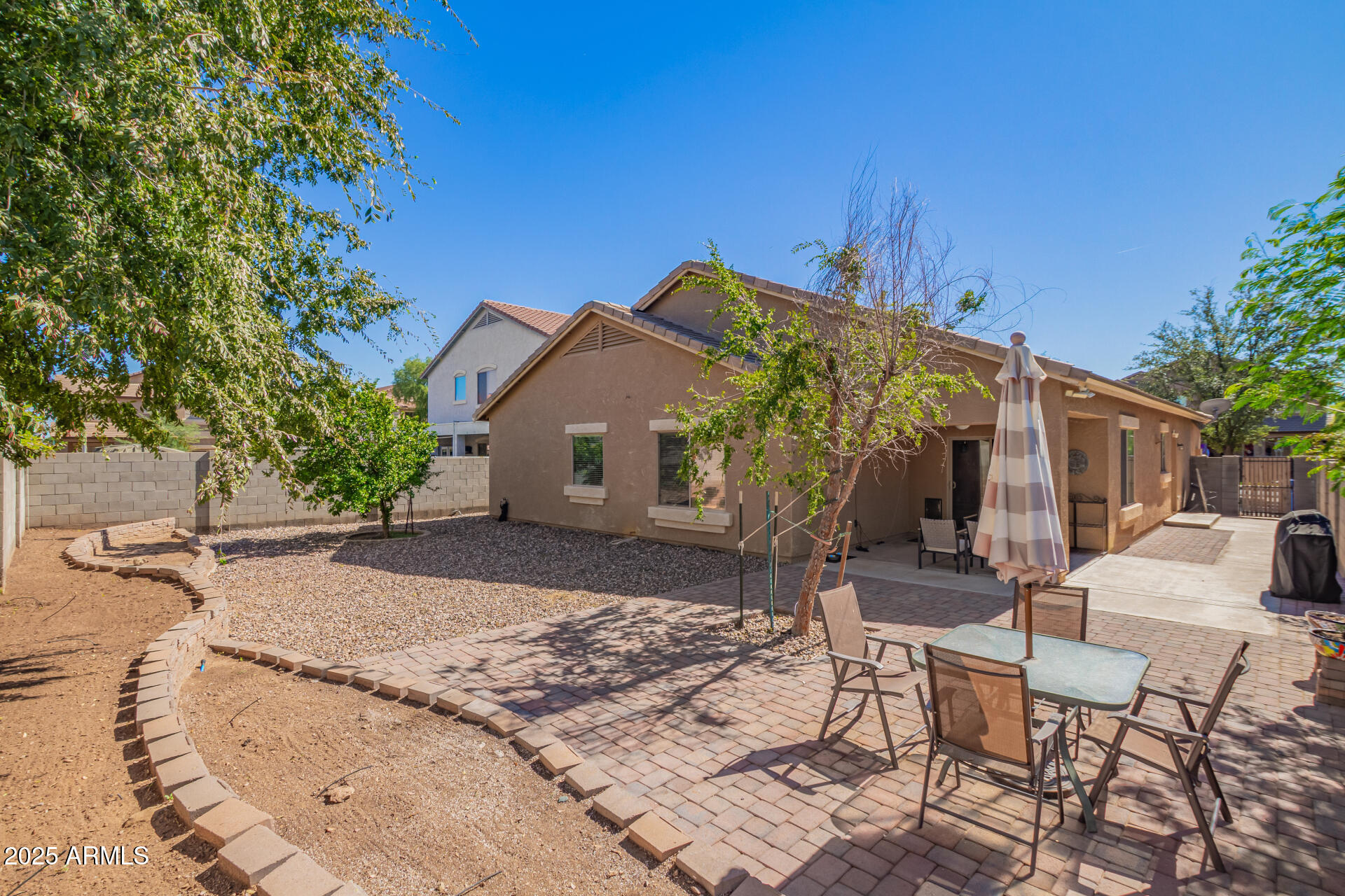 6934 West Beverly Road Laveen, AZ 85339 - Photo 28 of 31 a view of a house with backyard and sitting area