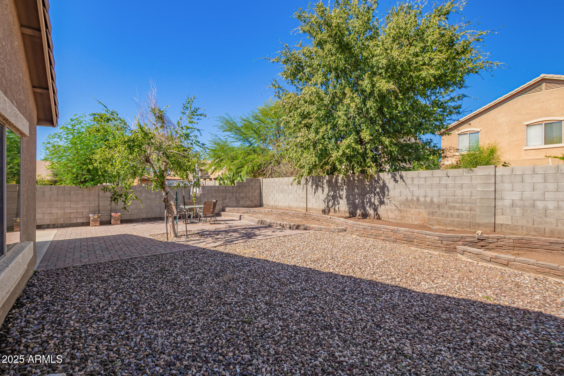 6934 West Beverly Road Laveen, AZ 85339 - Photo 30 of 31 a view of a yard with plants and trees