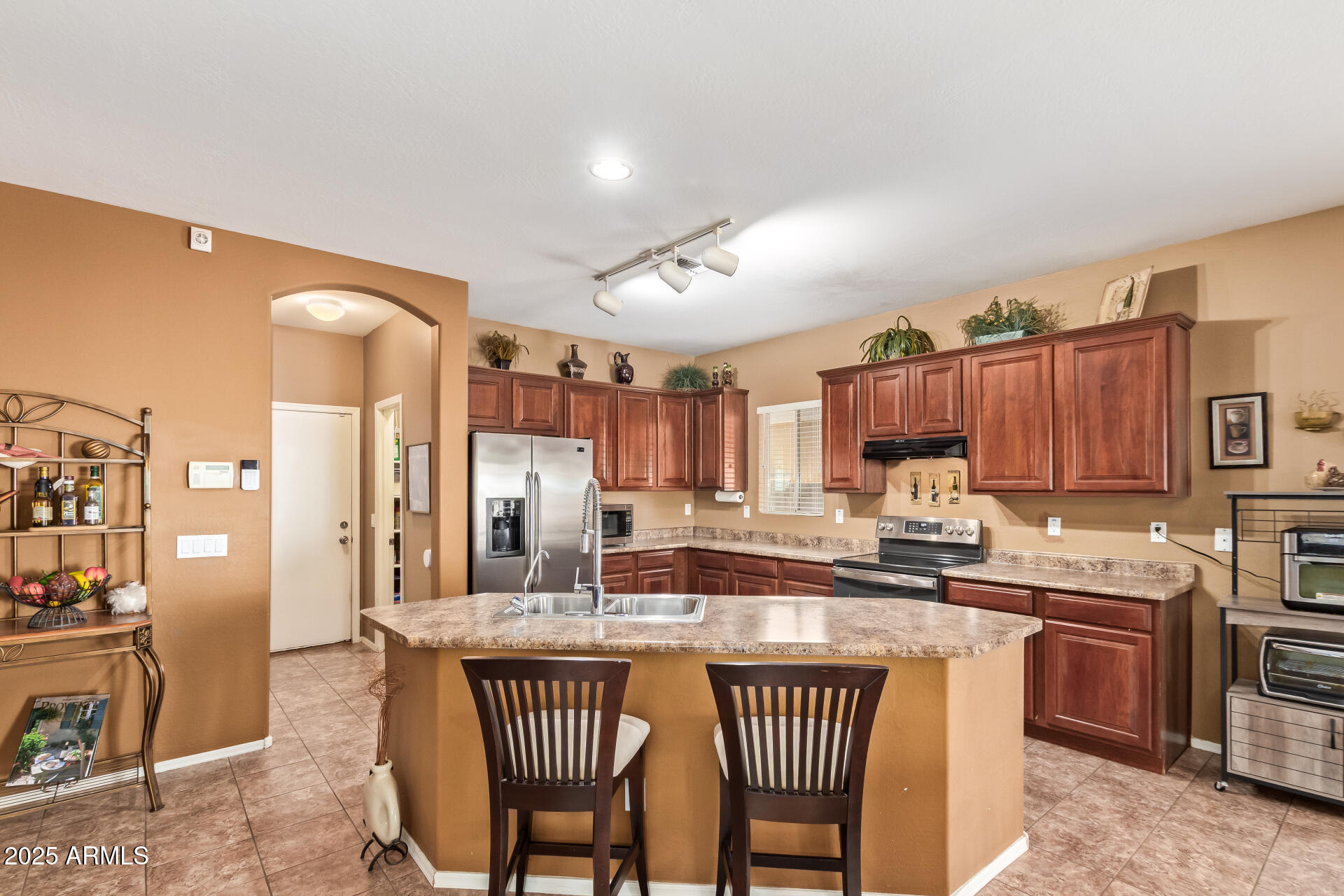 6934 West Beverly Road Laveen, AZ 85339 - Photo 9 of 31 a kitchen with a sink cabinets and window