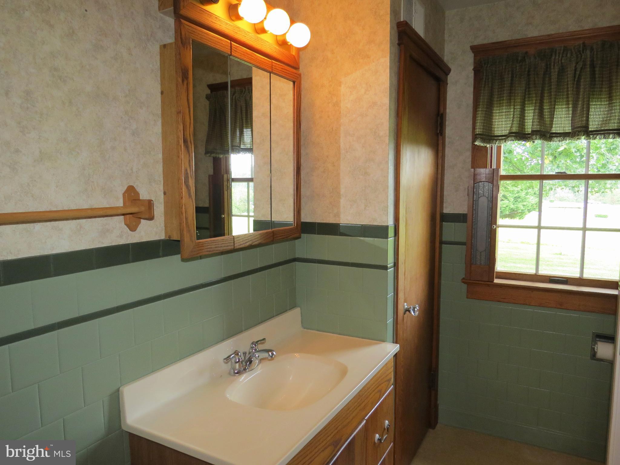 4418 Upper Beckleysville Road Hampstead, MD 21074 - Photo 15 of 25 a bathroom with a sink and a window