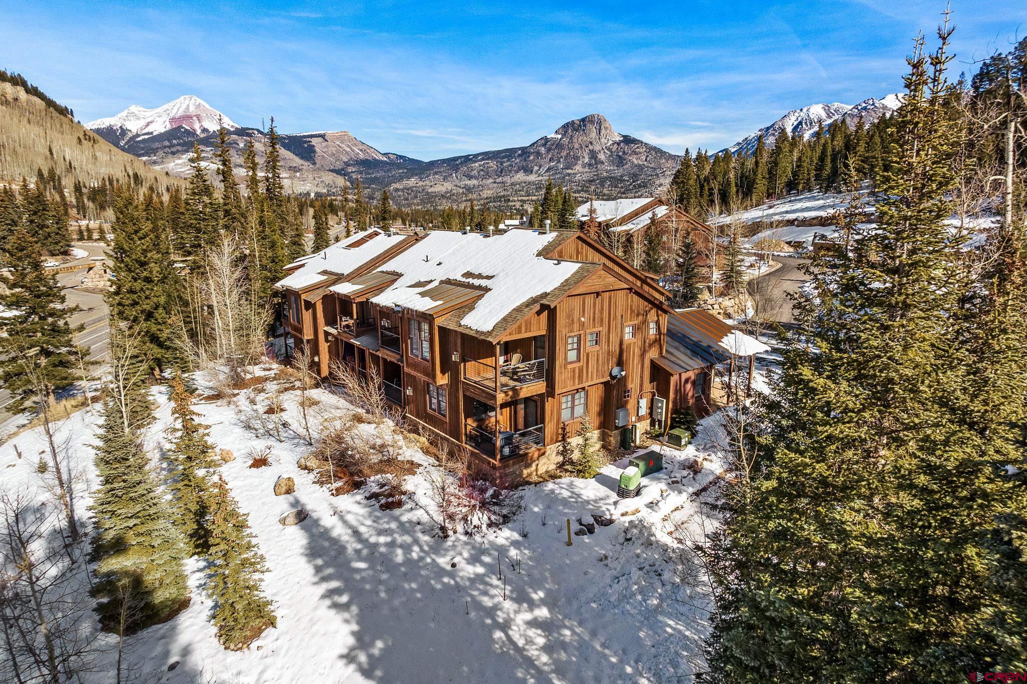 114 Limestone Court Durango, CO 81301 - Photo 32 of 35 a view of a large building with a mountain