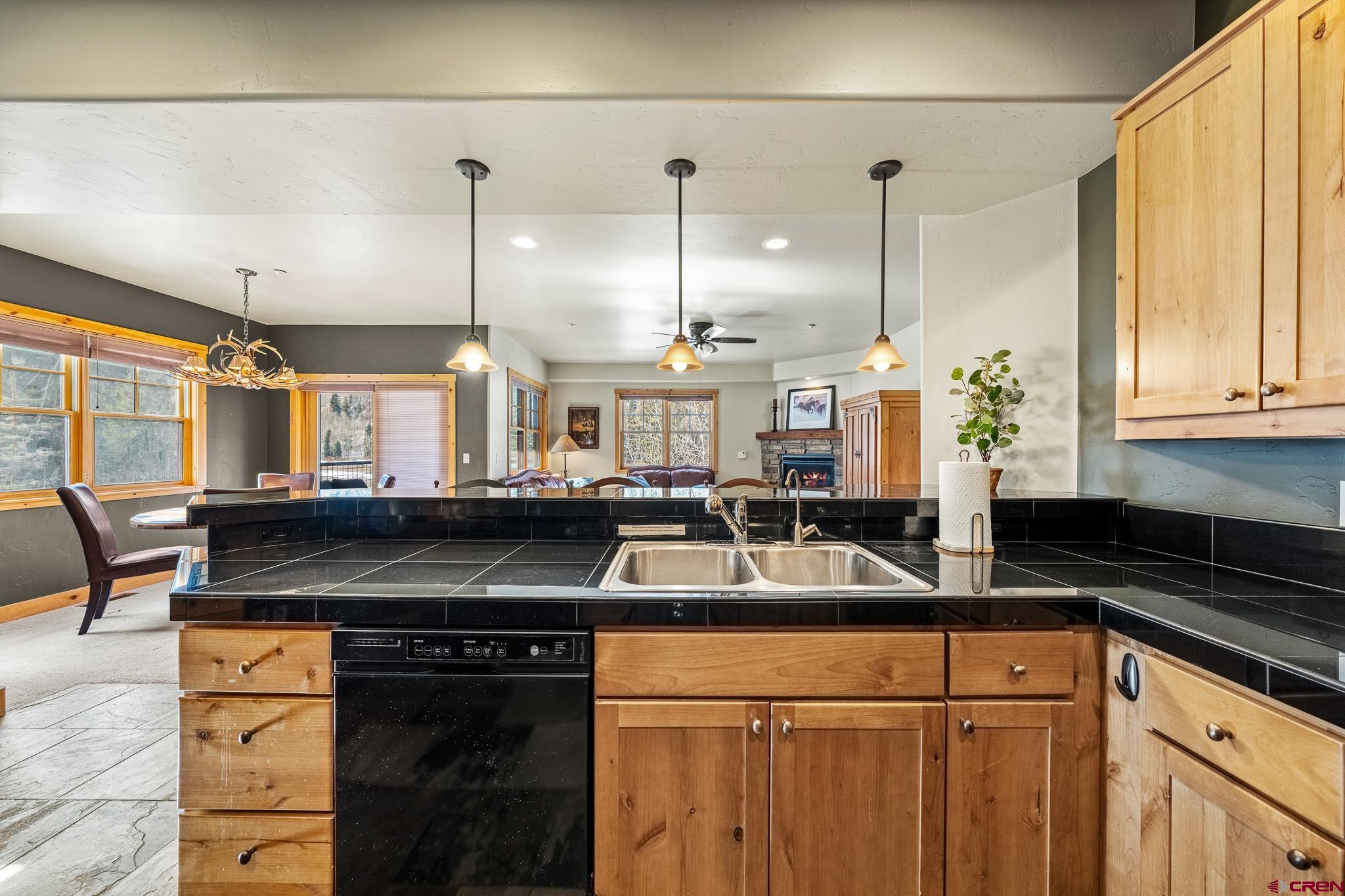 114 Limestone Court Durango, CO 81301 - Photo 8 of 35 a kitchen with a sink and a refrigerator