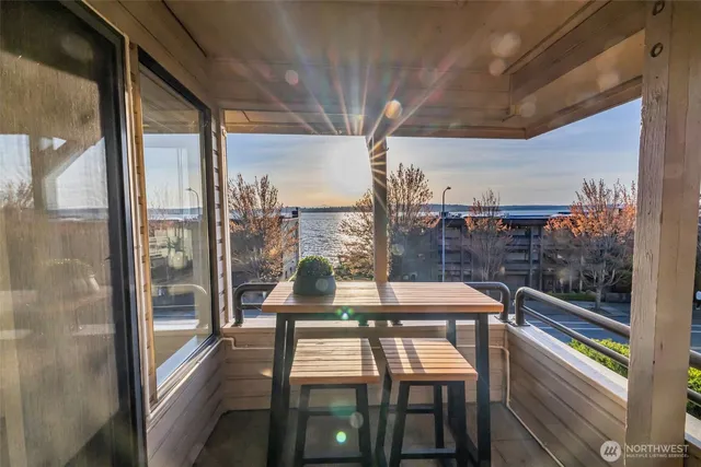 a view of a balcony with chairs