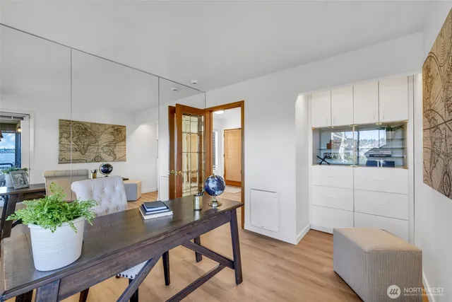 a view of a dining room with furniture window and wooden floor