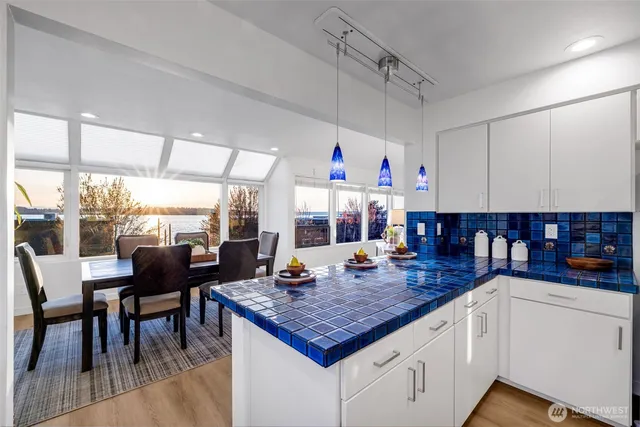 a view of a dining table chairs and chandelier