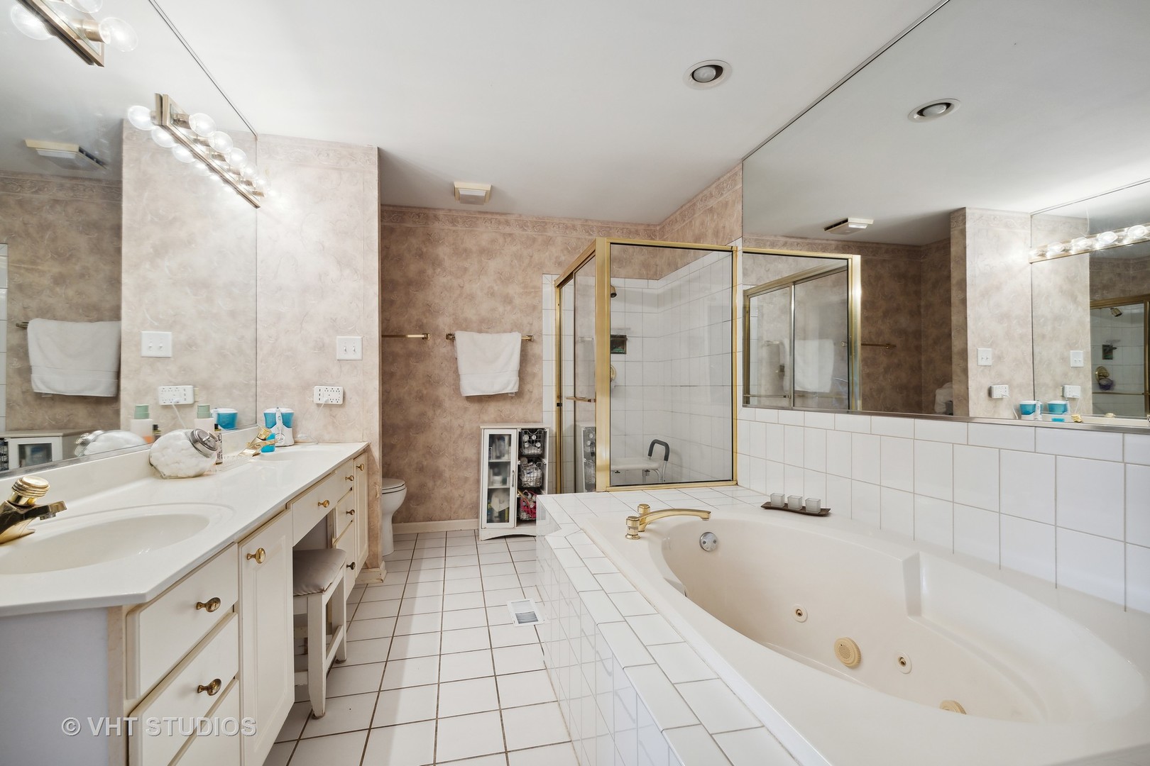 10001 Derby Lane Mokena, IL 60448 - Photo 16 of 31 a bathroom with a tub sink a mirror and a shower