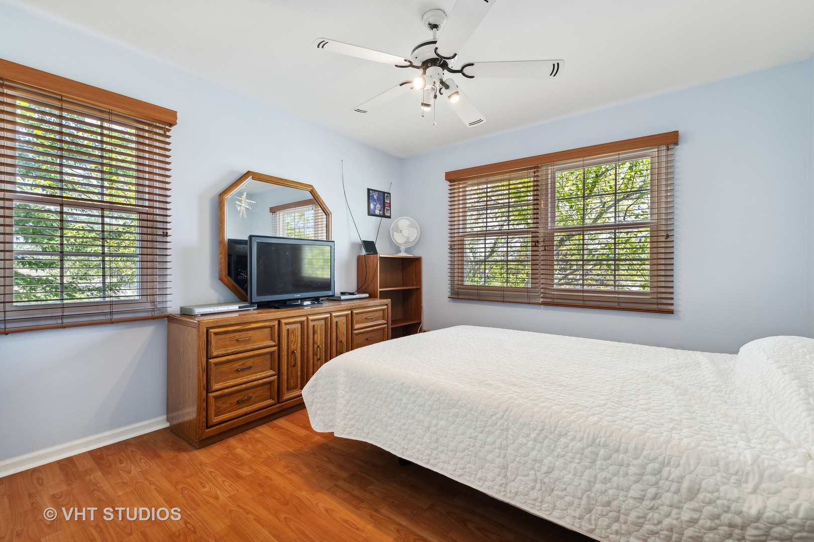 10001 Derby Lane Mokena, IL 60448 - Photo 17 of 31 a bedroom with a large bed a flat tv screen and a dresser