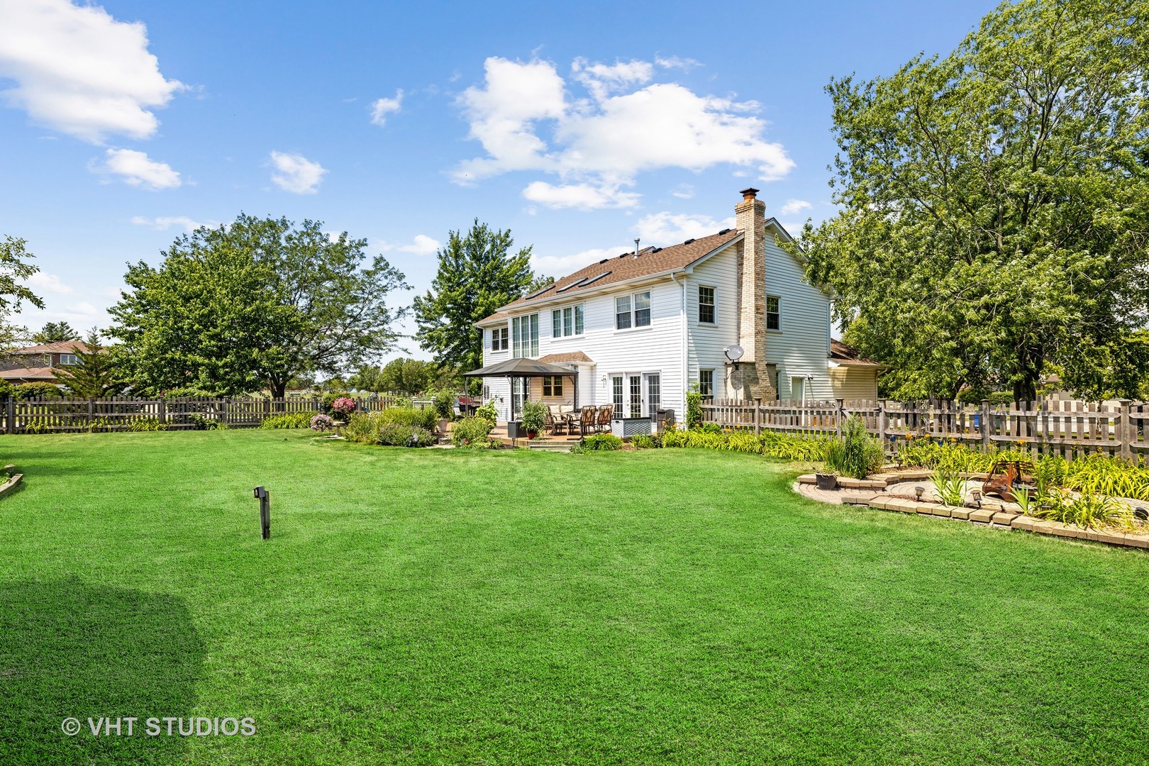 10001 Derby Lane Mokena, IL 60448 - Photo 24 of 31 a view of a house with a yard and sitting area