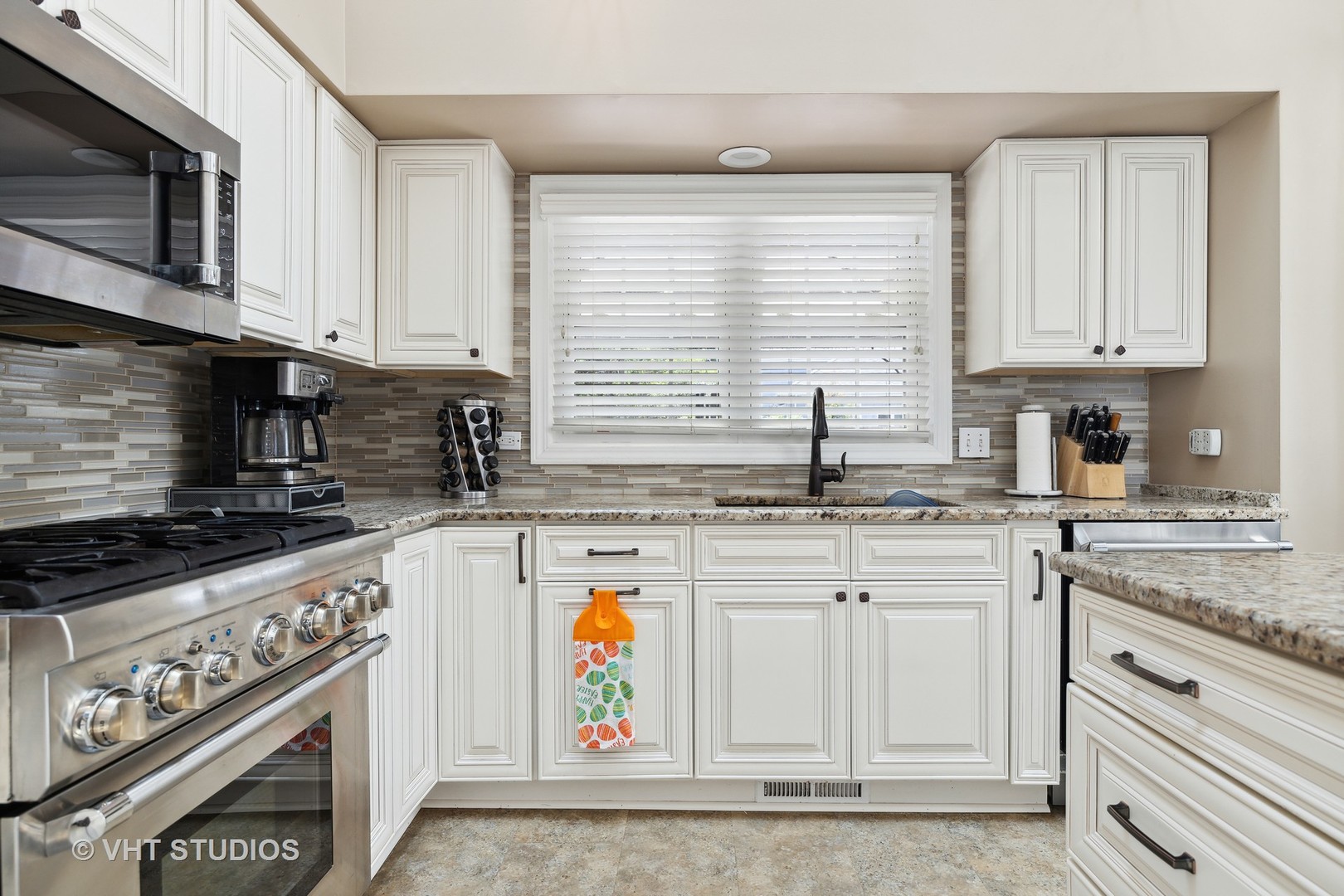 10001 Derby Lane Mokena, IL 60448 - Photo 5 of 31 a kitchen with stainless steel appliances granite countertop a sink and a stove
