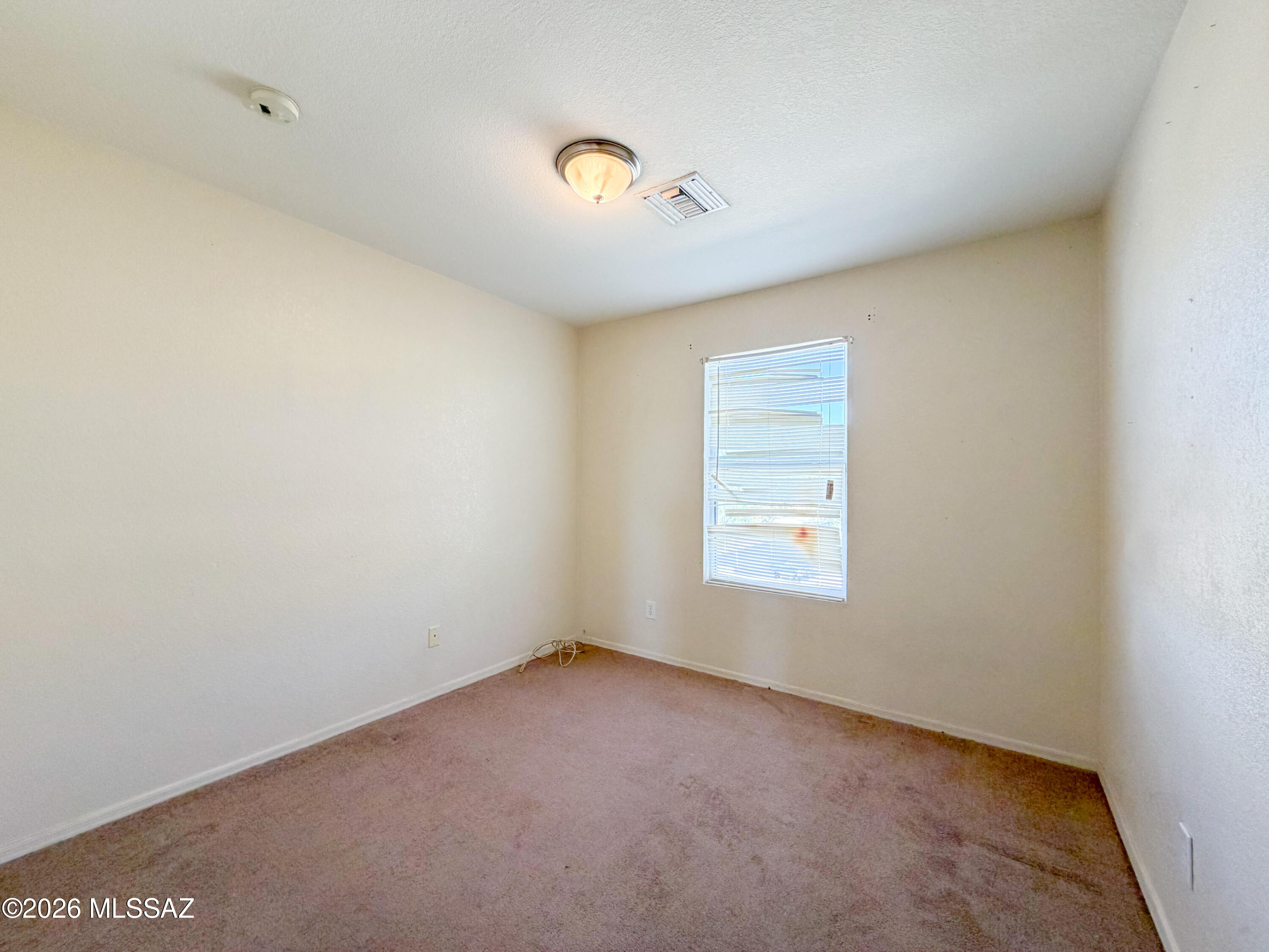 5779 South Manta Ray Road Tucson, AZ 85706 - Photo 14 of 30 a view of an empty room with a window