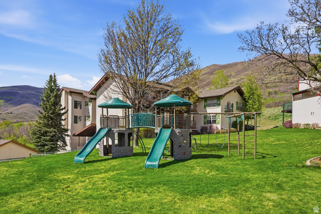1041 West Grindelwald Court, Unit R5 Midway, UT 84049 - Photo 38 of 44 Community playground with a mountain view and a lawn