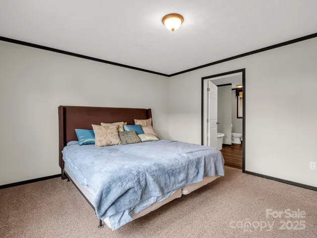 a bedroom with a bed and a cabinets