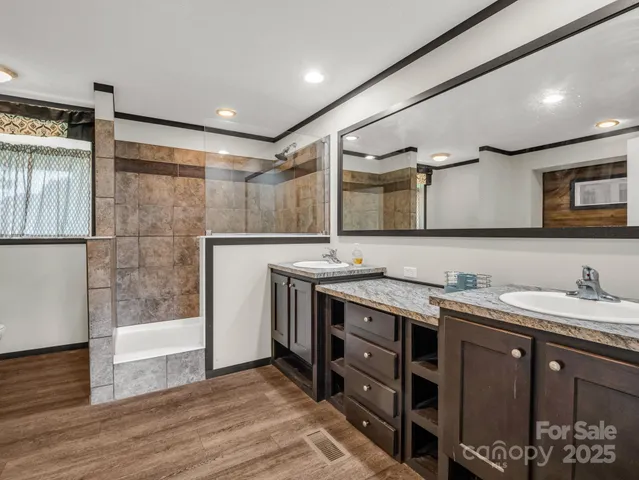 a bathroom with a sink a vanity and a mirror