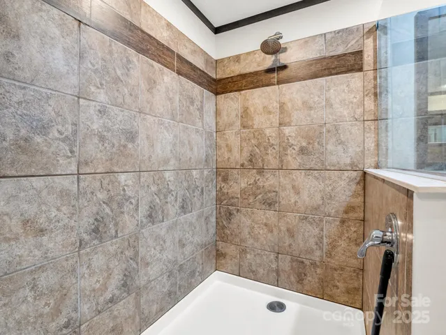 a bathroom with a shower and a bathtub