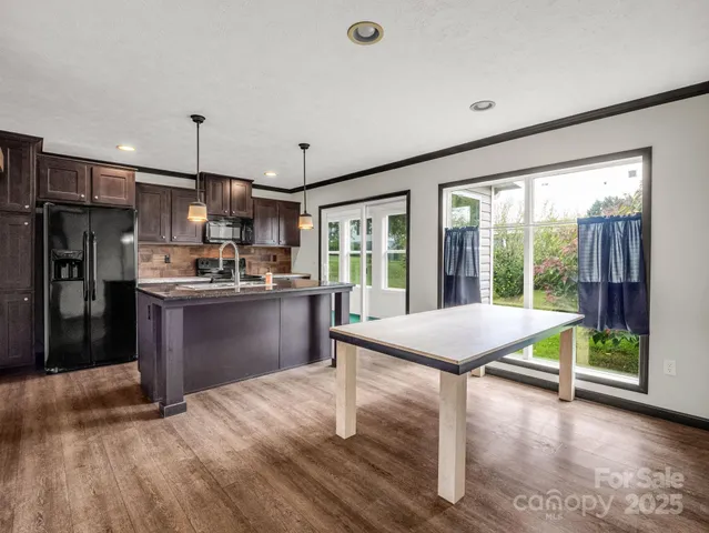 a kitchen with counter top space and appliances