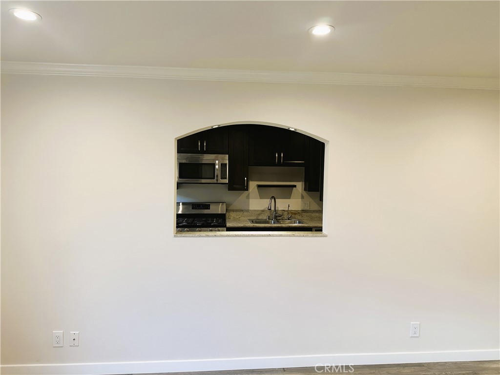 7307 Foothill Boulevard Tujunga, CA 91042 - Photo 5 of 27 a car parked in front of a door