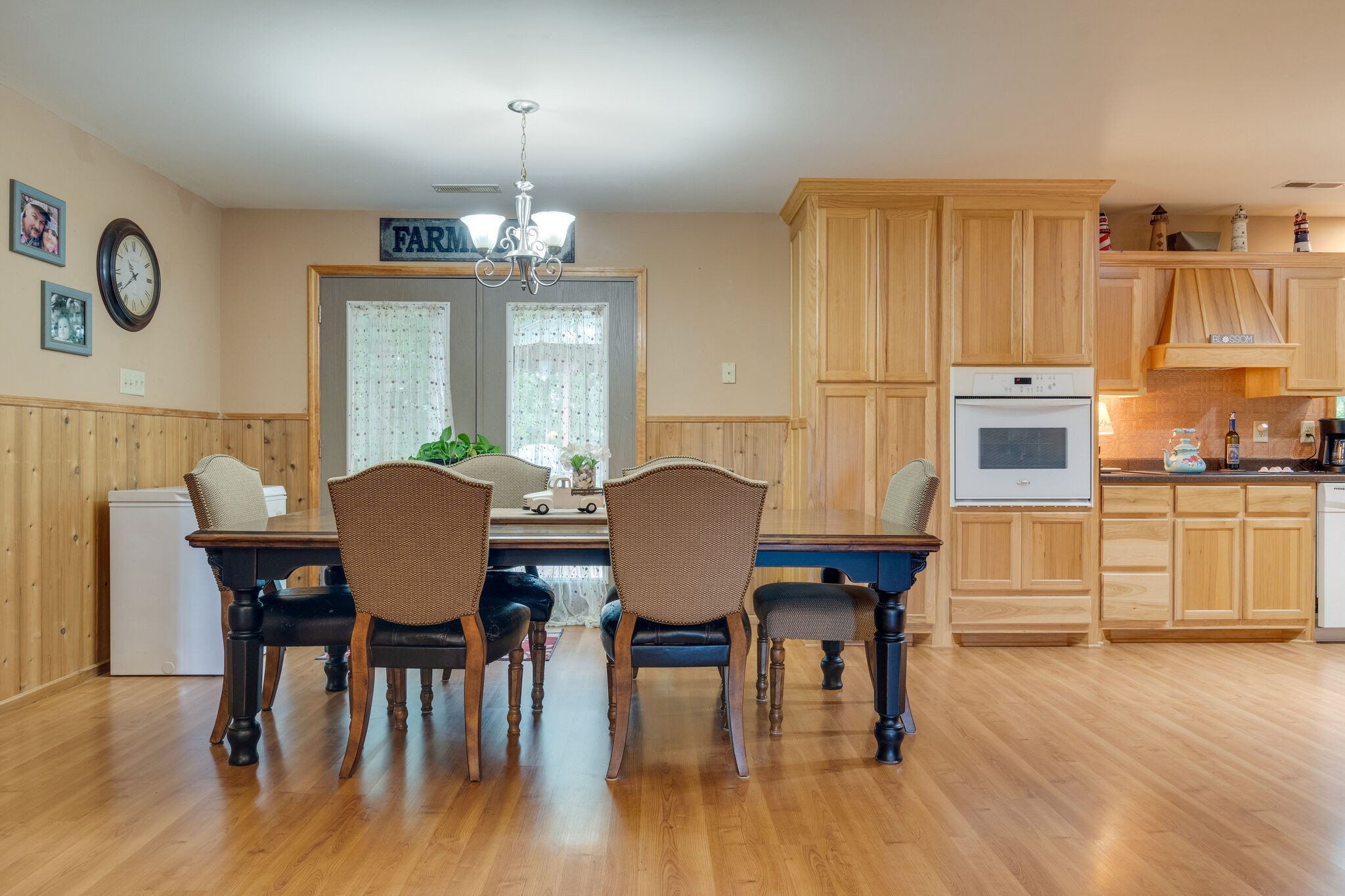 2329 Fall River Road Leoma, TN 38468 - Photo 29 of 54 a view of a dining room with furniture a chandelier and wooden floor
