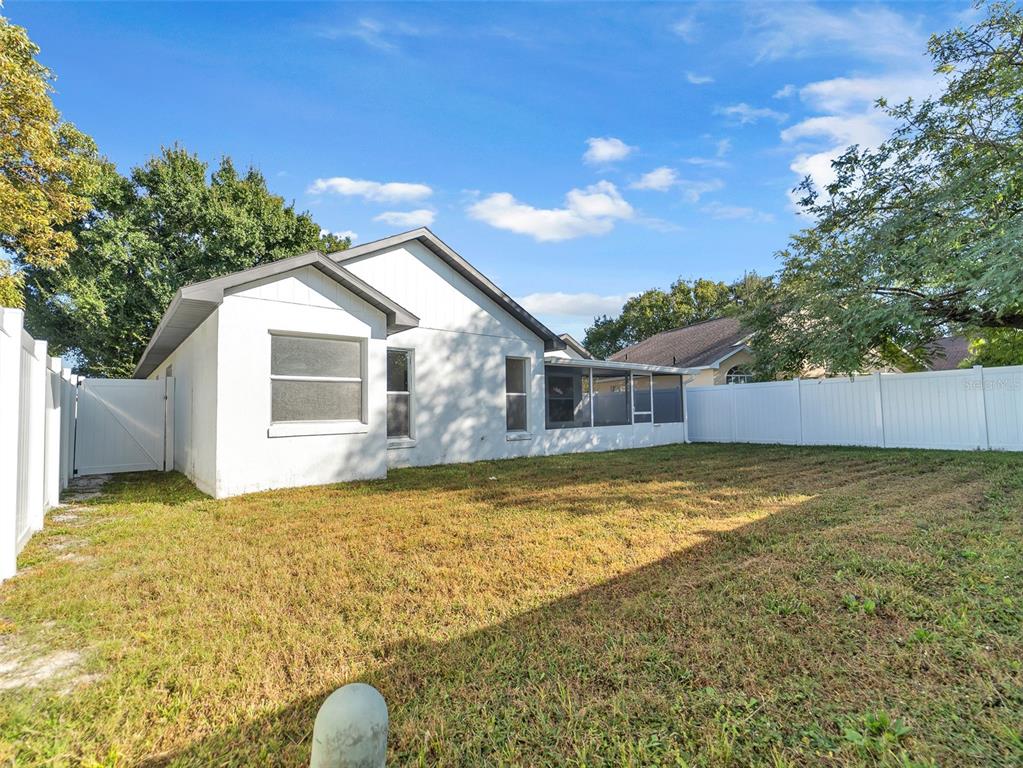 11606 Goodwyck Drive Orlando, FL 32837 - Photo 16 of 18 a front view of house with yard