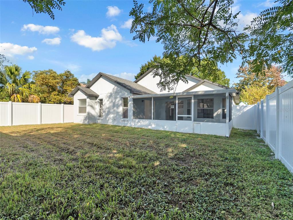 11606 Goodwyck Drive Orlando, FL 32837 - Photo 17 of 18 a view of a house with a backyard
