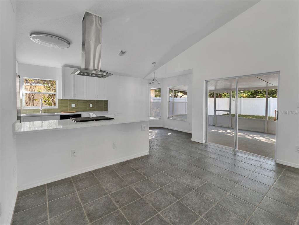 11606 Goodwyck Drive Orlando, FL 32837 - Photo 5 of 18 a large kitchen with cabinets and a stove