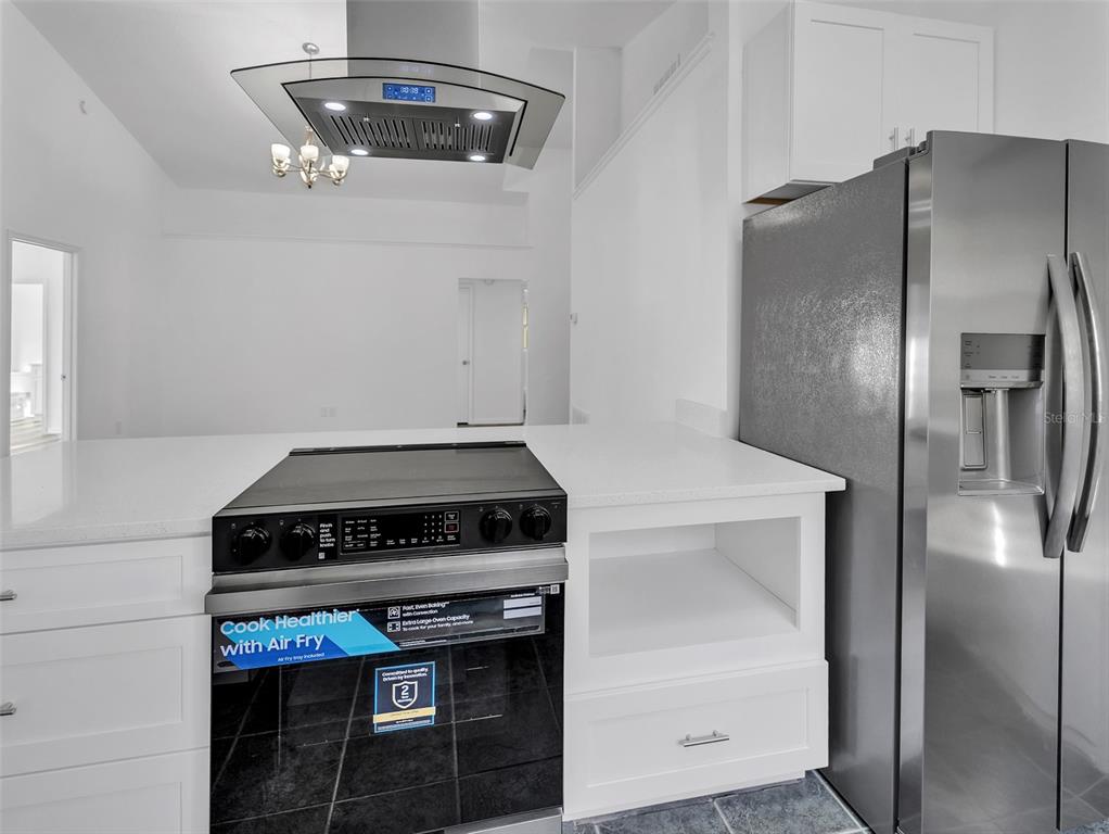 11606 Goodwyck Drive Orlando, FL 32837 - Photo 8 of 18 a stove top oven sitting inside of a kitchen