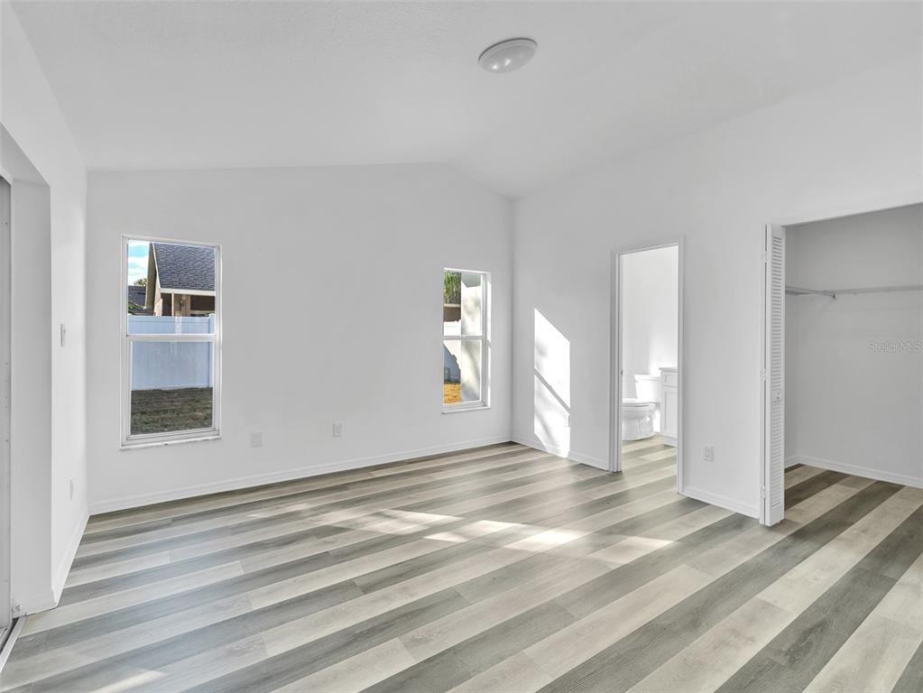 11606 Goodwyck Drive Orlando, FL 32837 - Photo 9 of 18 a view of a livingroom with wooden floor and window
