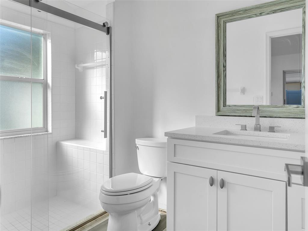 11606 Goodwyck Drive Orlando, FL 32837 - Photo 10 of 18 a bathroom with a sink toilet and shower