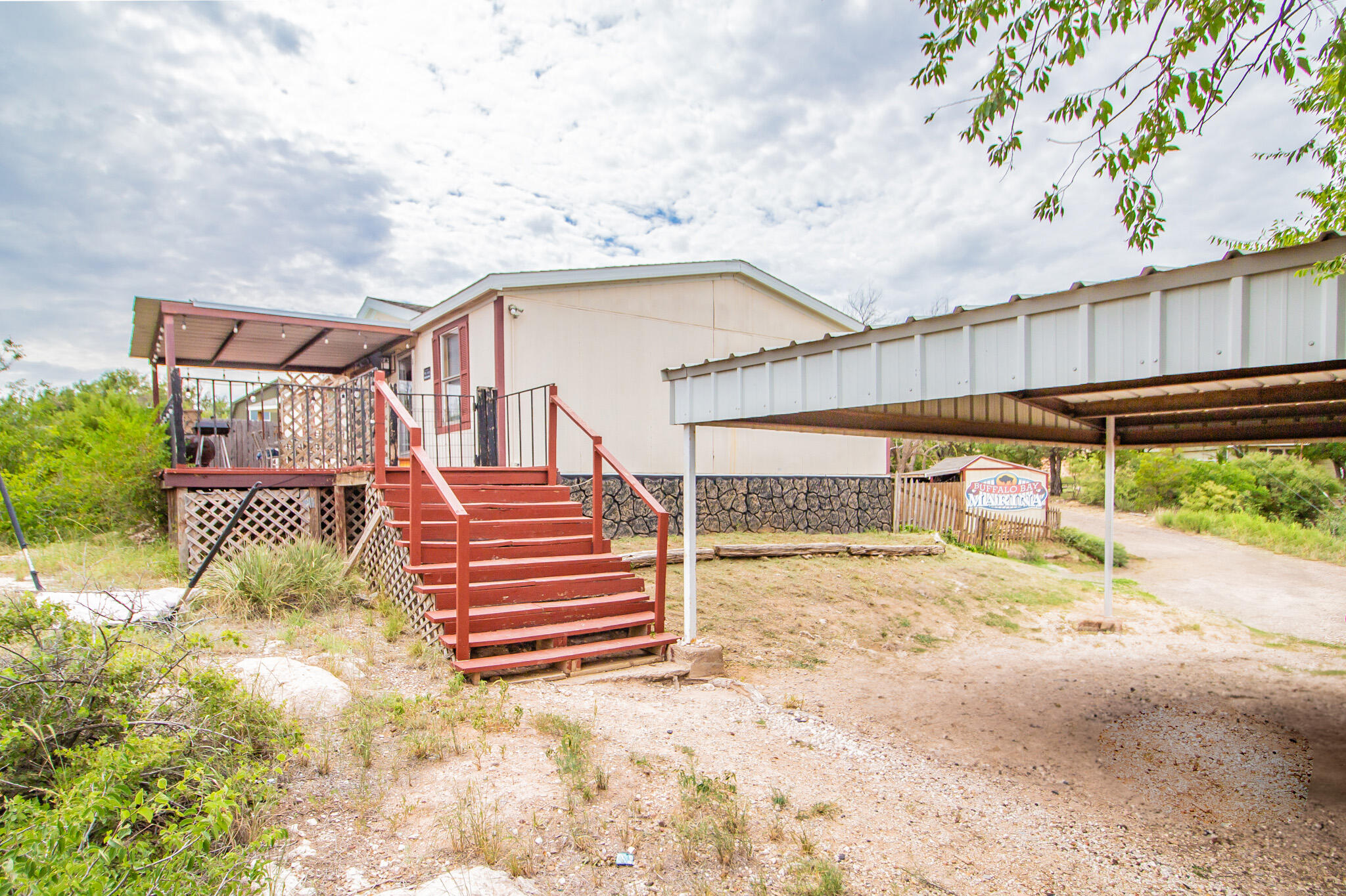 230 Bull Rider Road, Unit C Lubbock, TX 79404 - Photo 20 of 37 a view of a house with a wooden fence