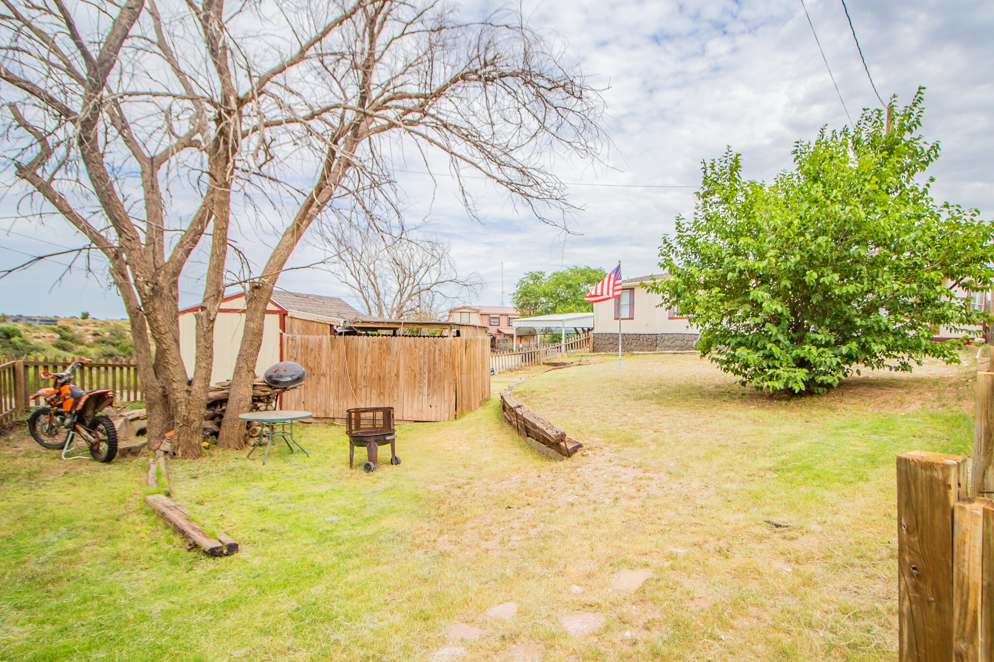 230 Bull Rider Road, Unit C Lubbock, TX 79404 - Photo 27 of 37 a view of swimming pool with a bench in patio
