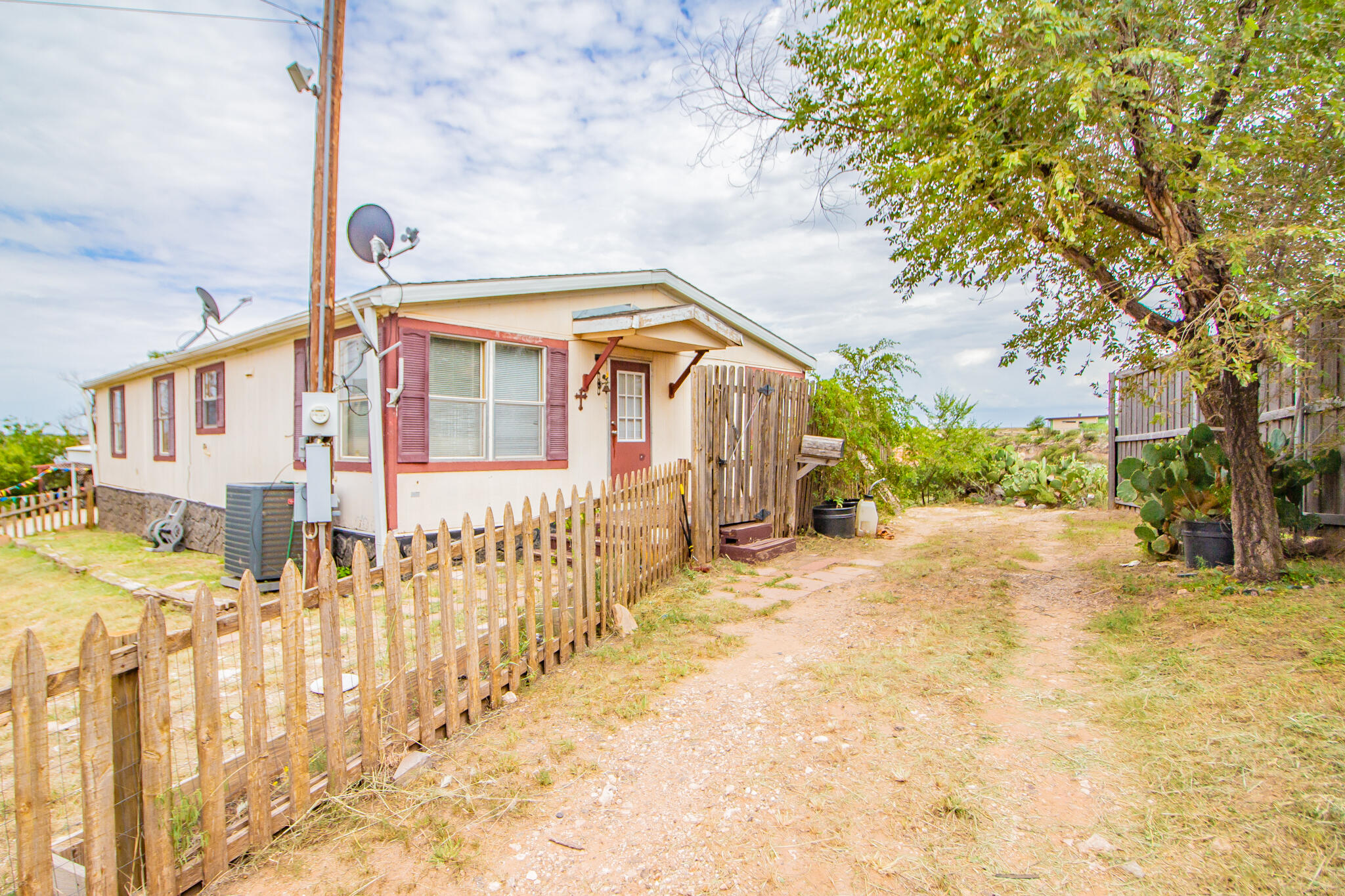 230 Bull Rider Road, Unit C Lubbock, TX 79404 - Photo 28 of 37 a front view of a house with a outdoor space