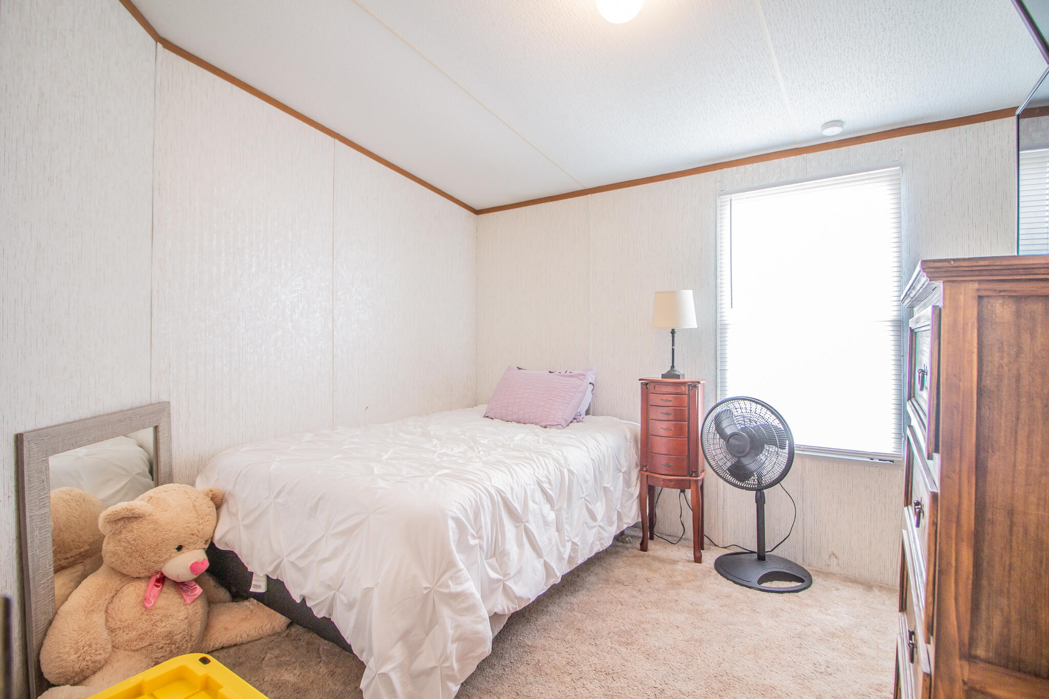 230 Bull Rider Road, Unit C Lubbock, TX 79404 - Photo 8 of 37 a bedroom with a bed and a window