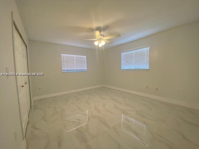 3432 Northwest 4th Street, Unit 2 Miami, FL 33125 - Photo 12 of 13 a view of an empty room with a window