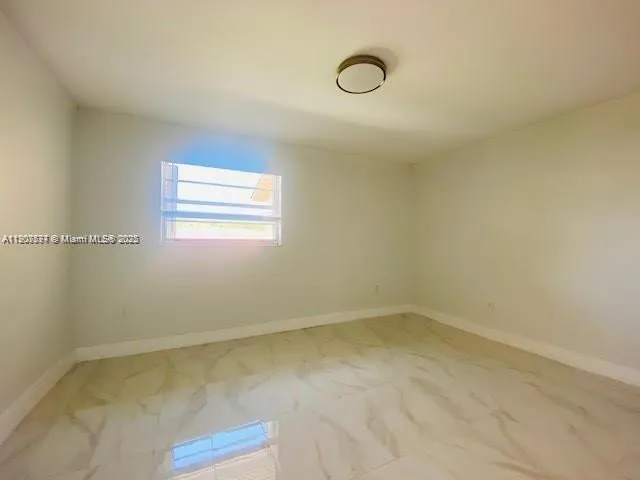 a view of a room that has a window